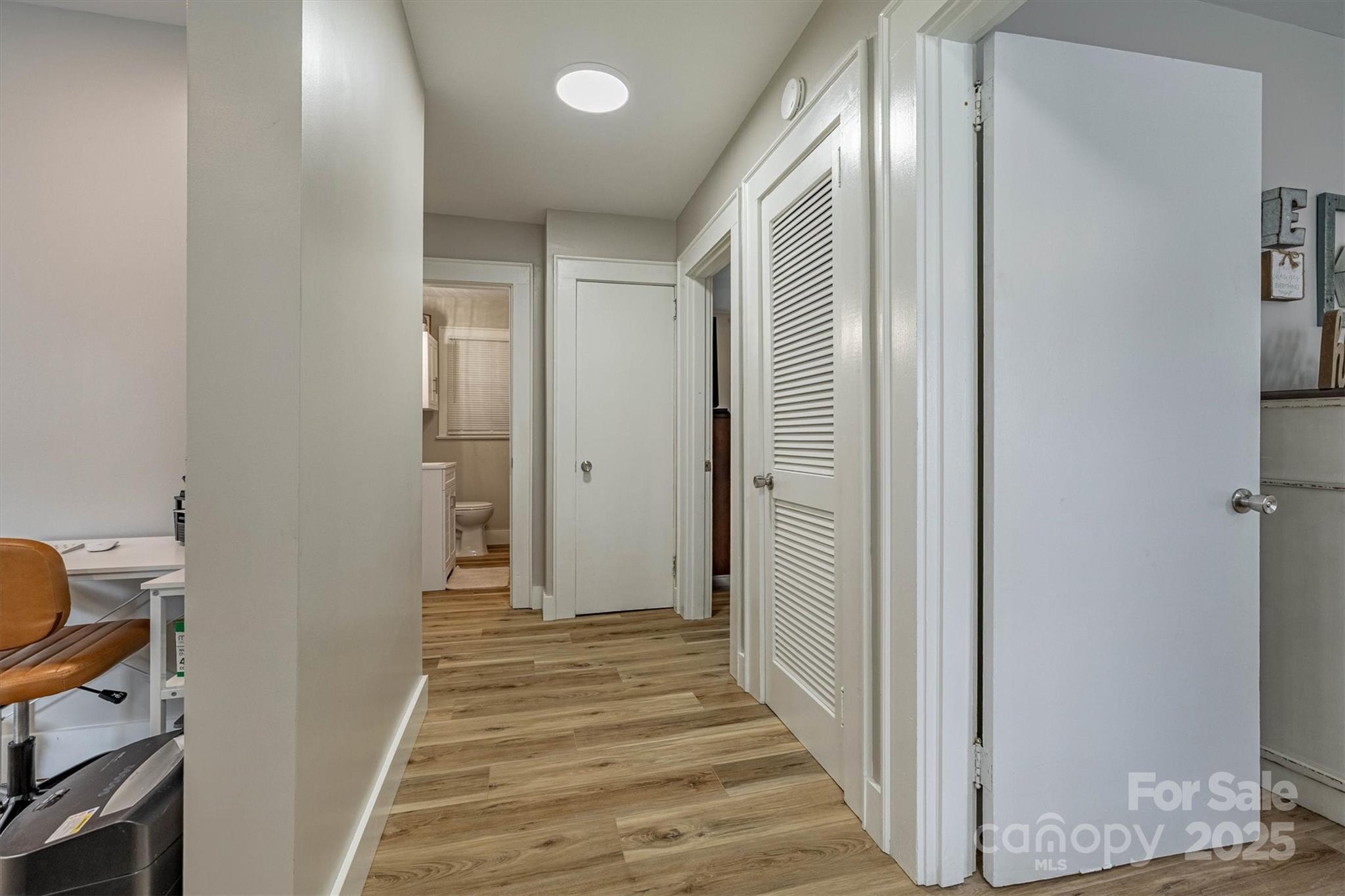 2625 20th St Lane Northeast Hickory, NC 28601 - Photo 10 of 31 a view of a hallway with wooden floor and closet