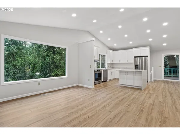 a view of kitchen with wooden floor