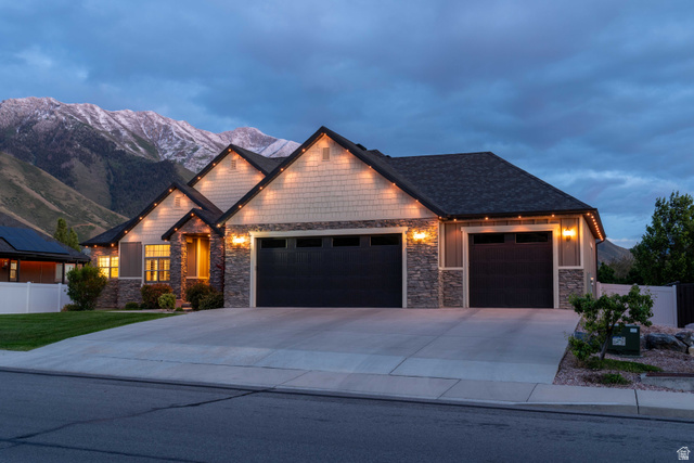 646 East 1400th Street North Mapleton, UT 84664 - Photo 7 of 78 Ranch-style residence featuring a stone and shingle facade, a two-car garage, and a snow-capped mountain backdrop