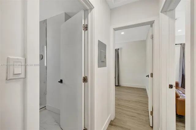 a view of a bathroom from the hallway