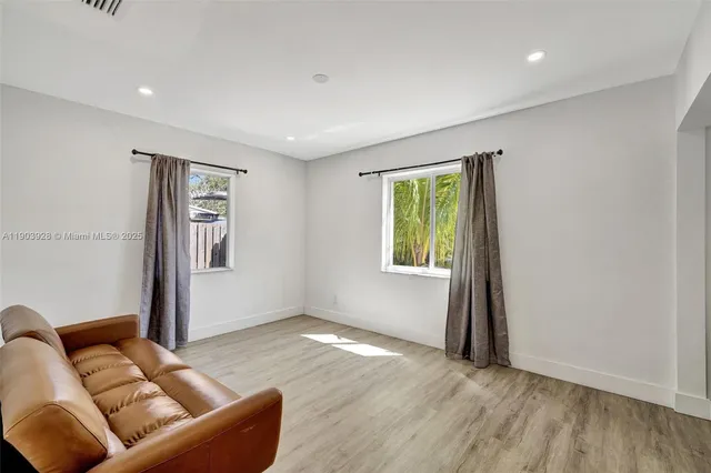 a living room with furniture and a window