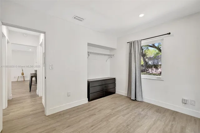 a view of an empty room and window