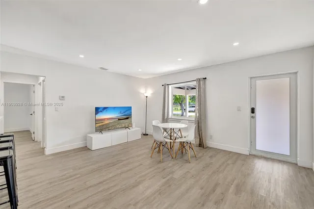 a view of a livingroom with furniture and wooden floor