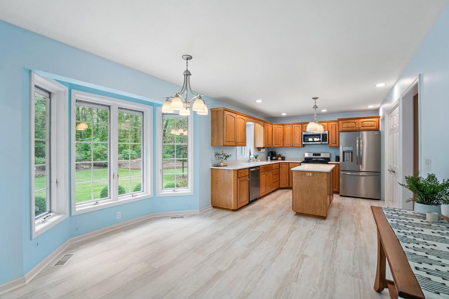 5964 West Schultz Road La Porte, IN 46350 - Photo 18 of 53 a large kitchen with a large window a counter space a sink and stainless steel appliances