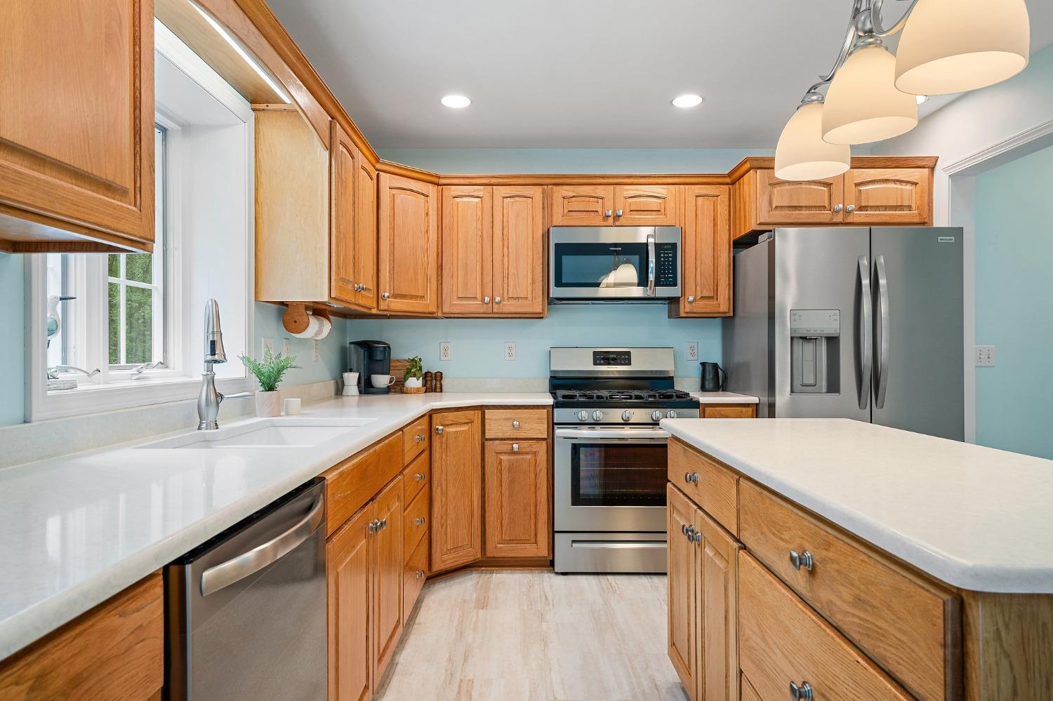 5964 West Schultz Road La Porte, IN 46350 - Photo 21 of 53 a kitchen with stainless steel appliances granite countertop a refrigerator sink and stove