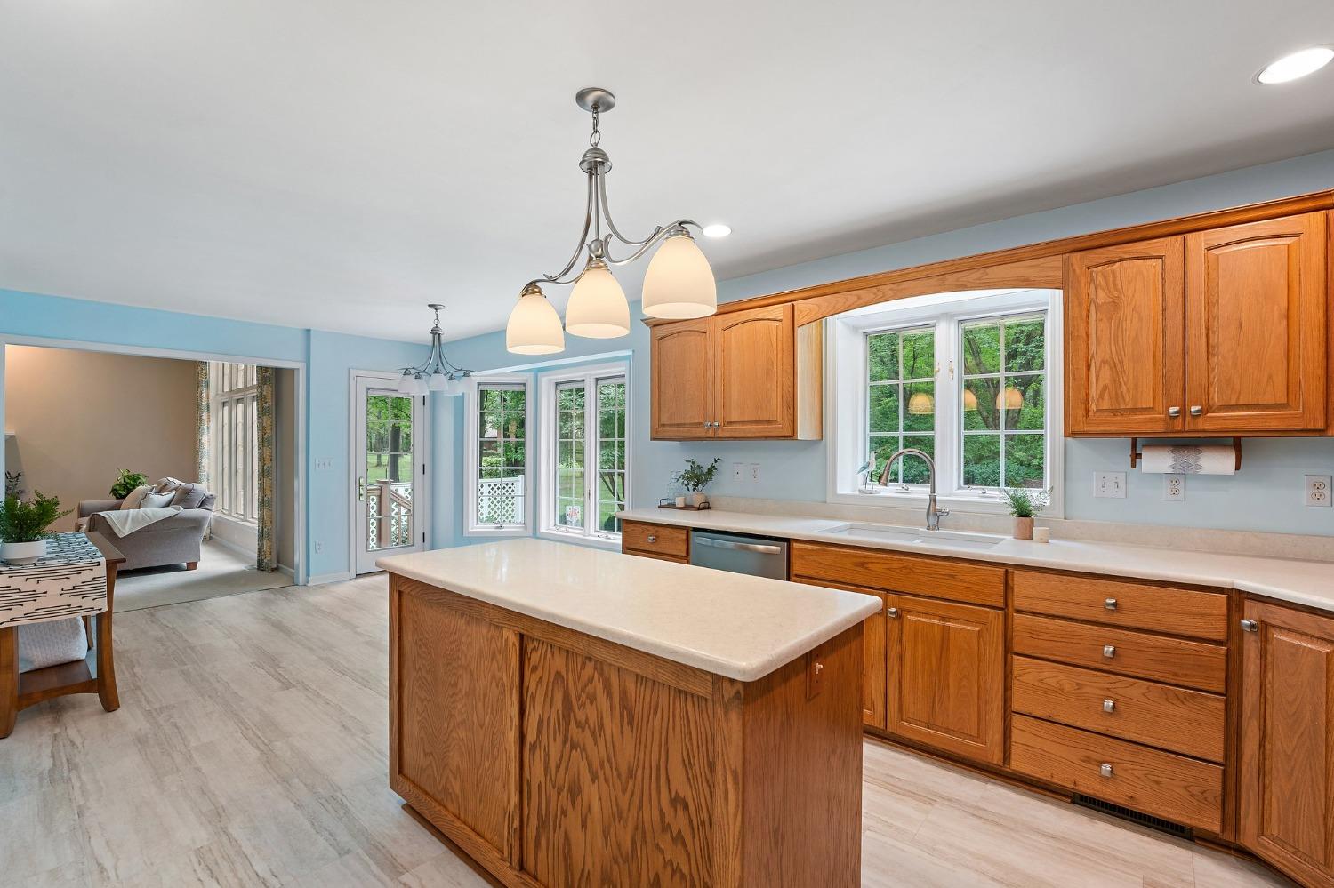 5964 West Schultz Road La Porte, IN 46350 - Photo 24 of 53 a kitchen with a sink a window and chairs