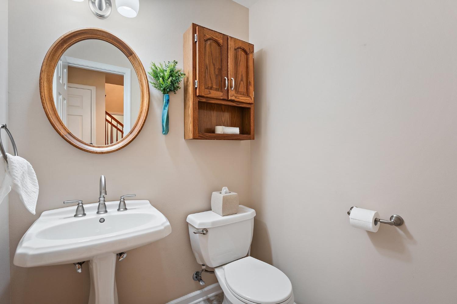 5964 West Schultz Road La Porte, IN 46350 - Photo 28 of 53 a bathroom with a toilet a sink and a mirror