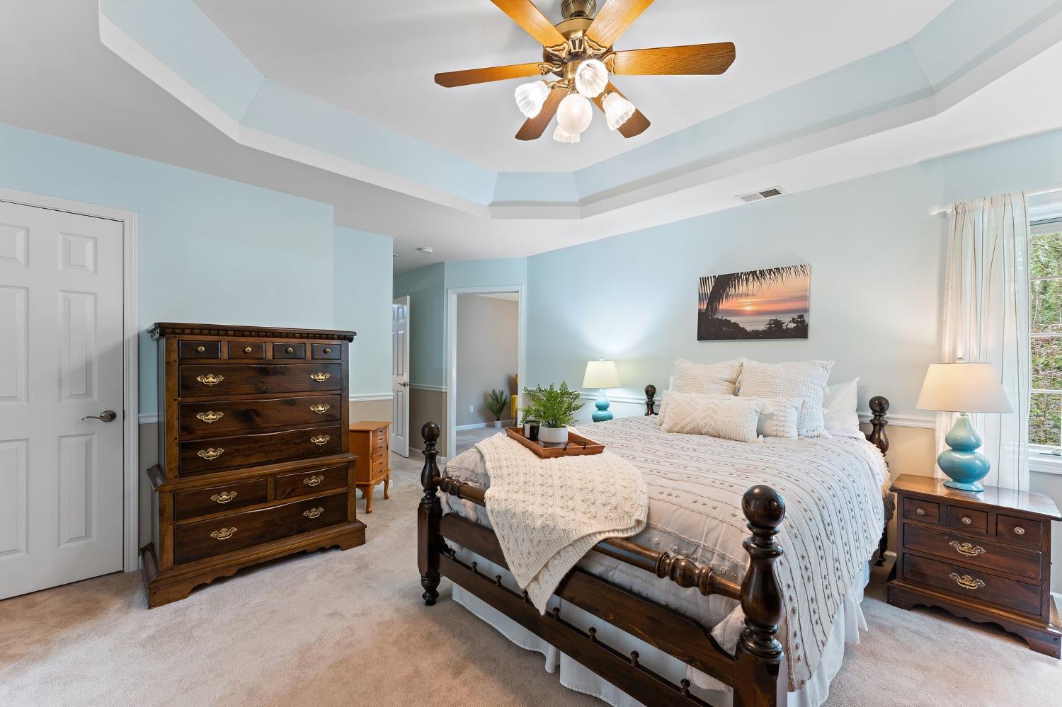 5964 West Schultz Road La Porte, IN 46350 - Photo 33 of 53 a bedroom with a bed a dresser and a chandelier