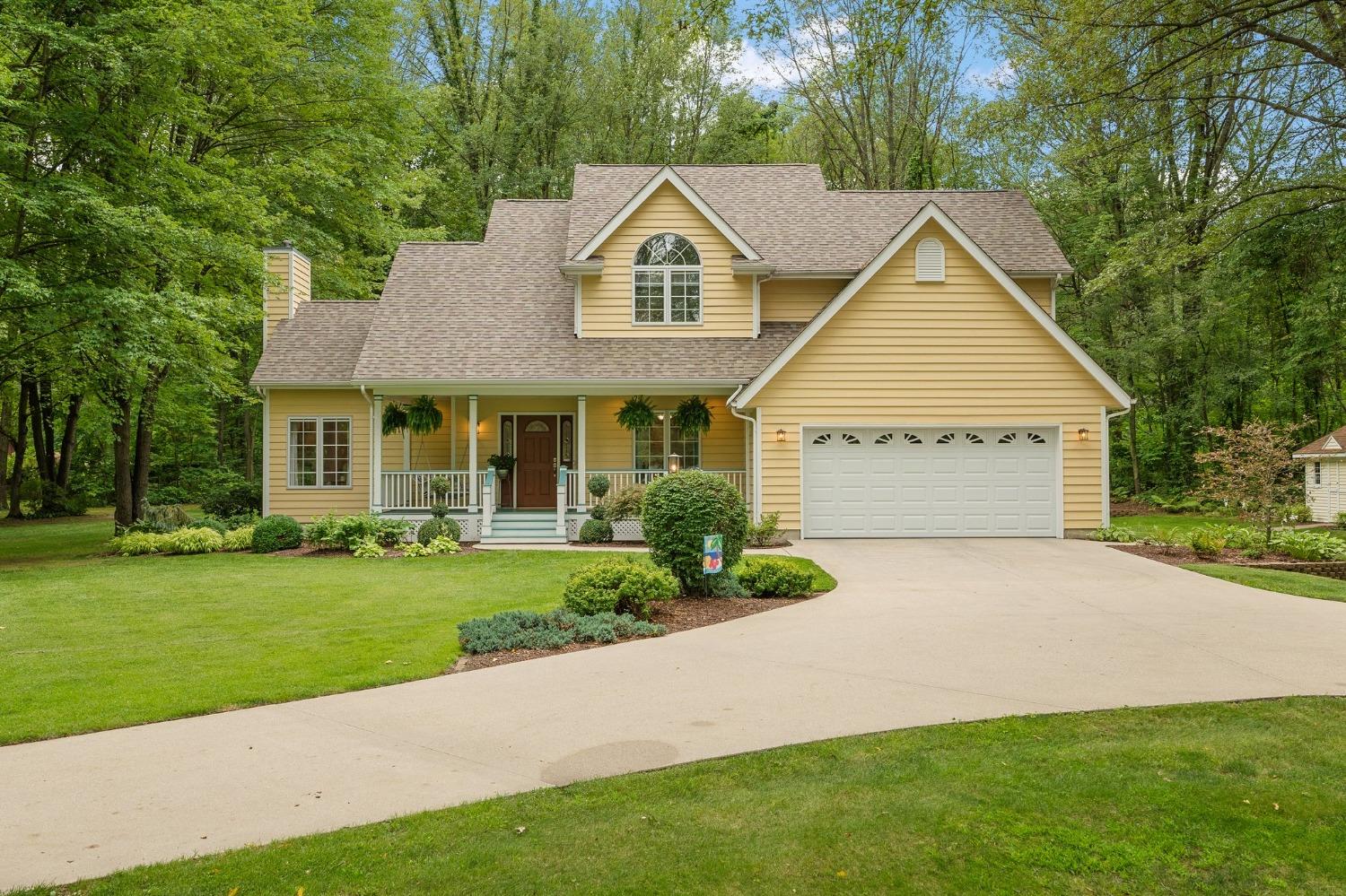 5964 West Schultz Road La Porte, IN 46350 - Photo 4 of 53 a view of a big house with a big yard and potted plants and large trees