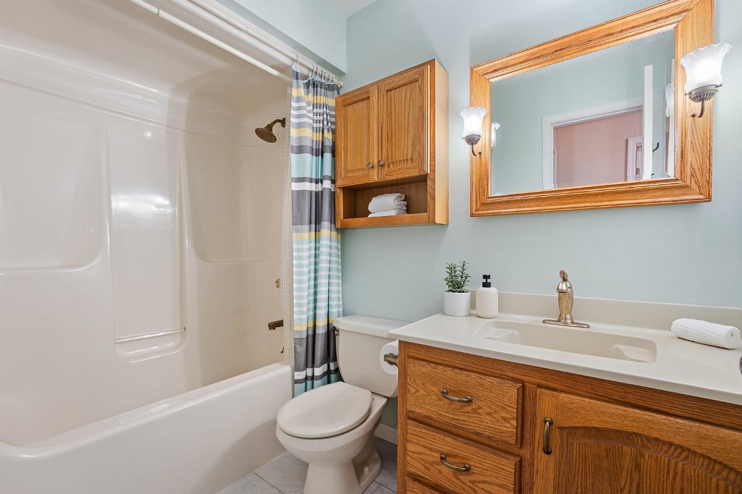 5964 West Schultz Road La Porte, IN 46350 - Photo 41 of 53 a bathroom with a granite countertop toilet sink and mirror