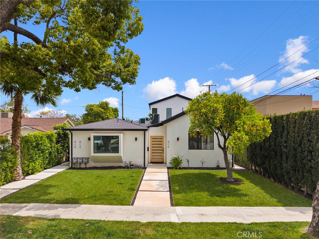 914 North Catalina Street Burbank, CA 91505 - Photo 1 of 1 a front view of a house with a garden and tree