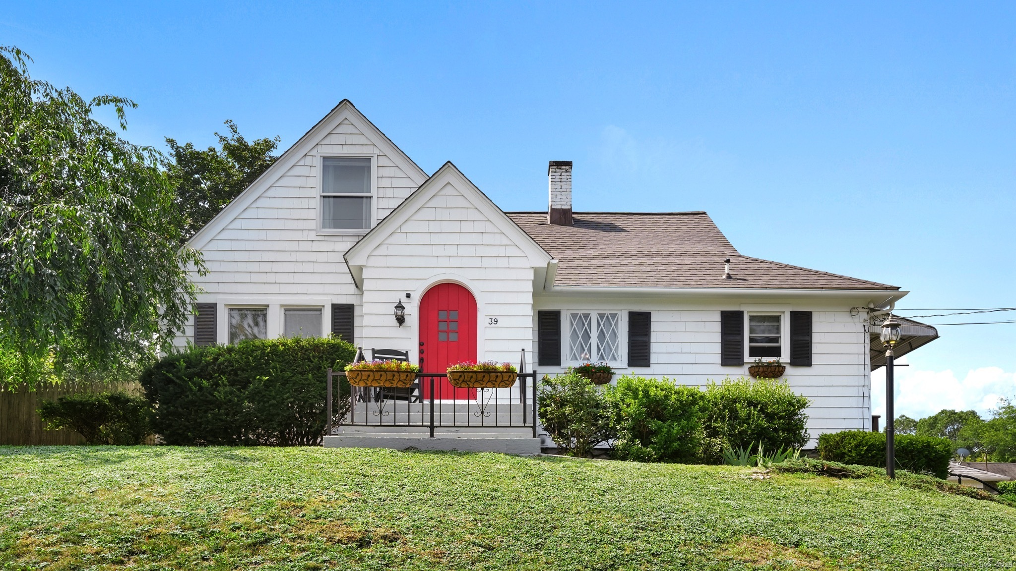 39 Alma Street Naugatuck, CT 06770 - Photo 1 of 1 a front view of a house with a yard