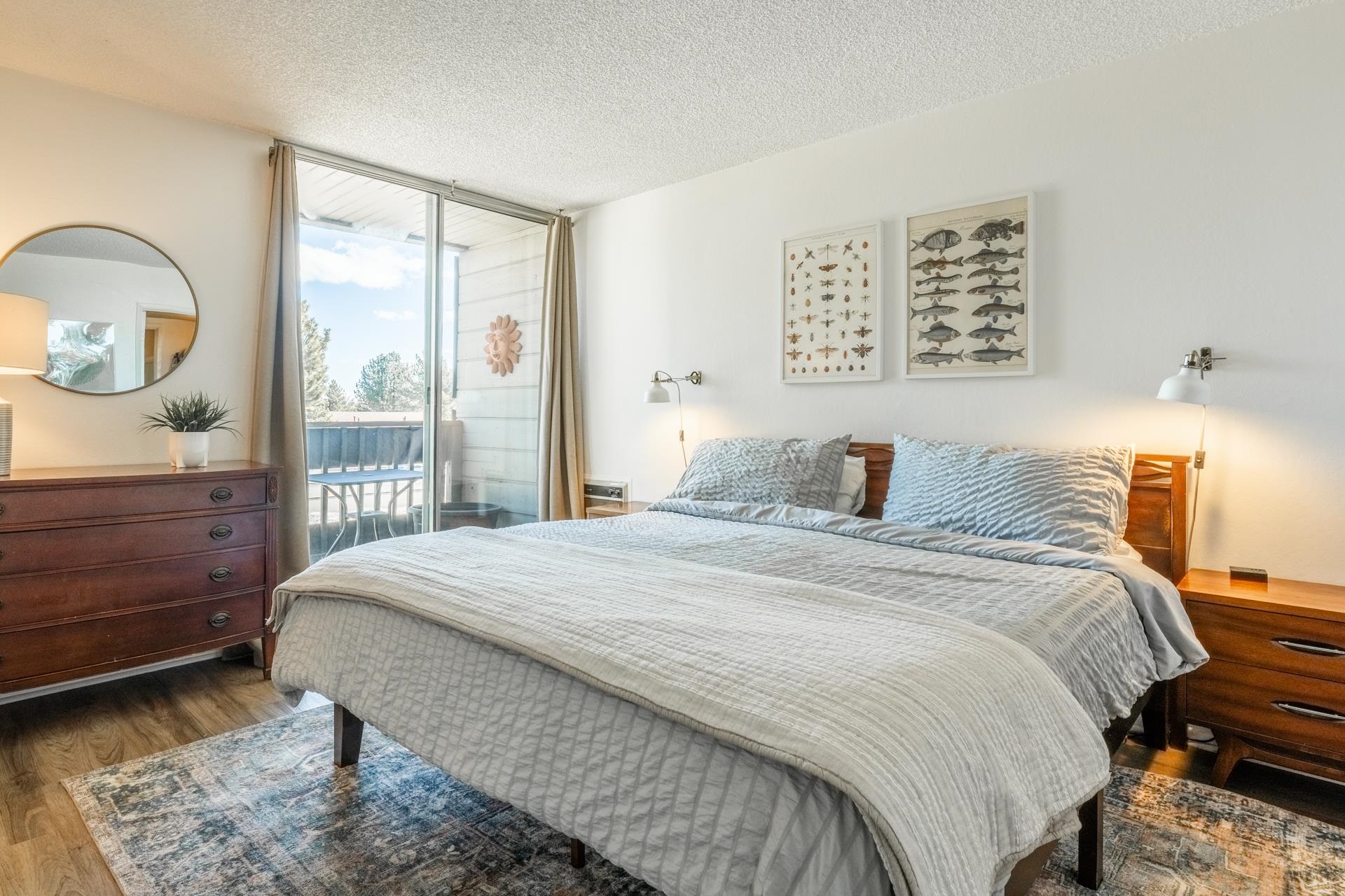 137 Laurel Mountain Road, Unit 227 Mammoth Lakes, CA 93546 - Photo 13 of 28 Bedroom with access to outside, a textured ceiling, and dark wood-style flooring