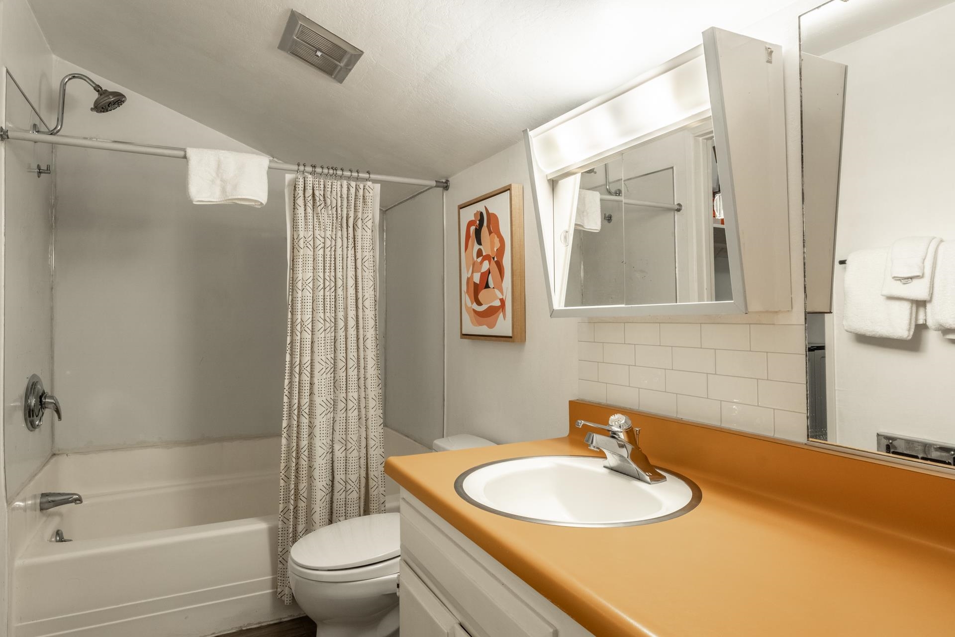 137 Laurel Mountain Road, Unit 227 Mammoth Lakes, CA 93546 - Photo 19 of 28 Full bath with vanity, shower / bath combination with curtain, and decorative backsplash