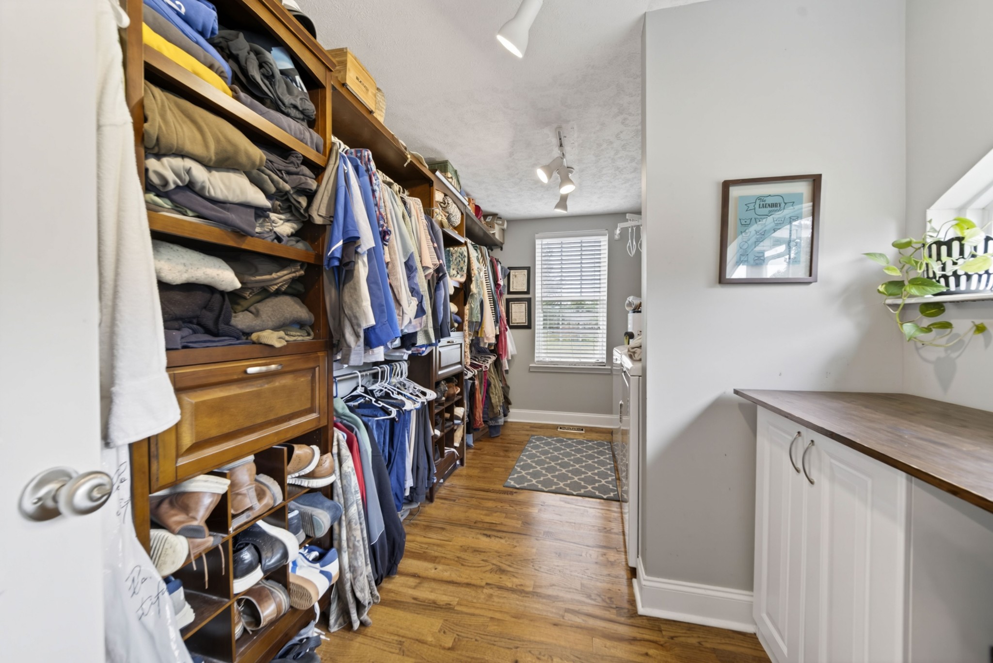 8023 Bethlehem Road Springfield, TN 37172 - Photo 44 of 55 a view of walk in closet with clothes and shoes