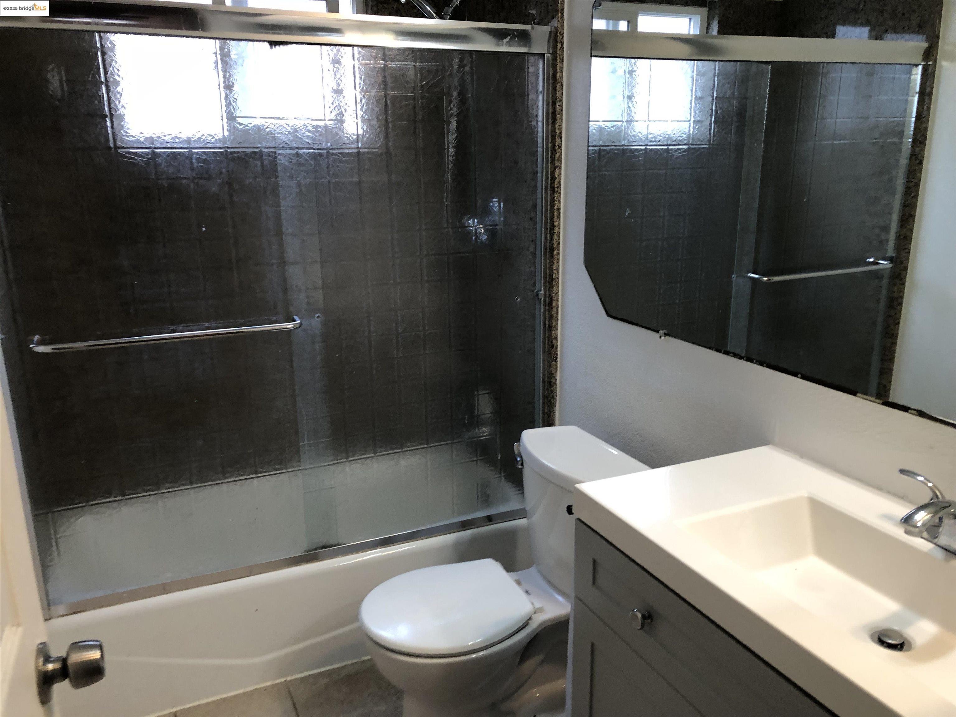 2174 Sugartree Drive Pittsburg, CA 94565 - Photo 12 of 12 Full bath featuring vanity, shower / bath combination with glass door, and tile patterned flooring