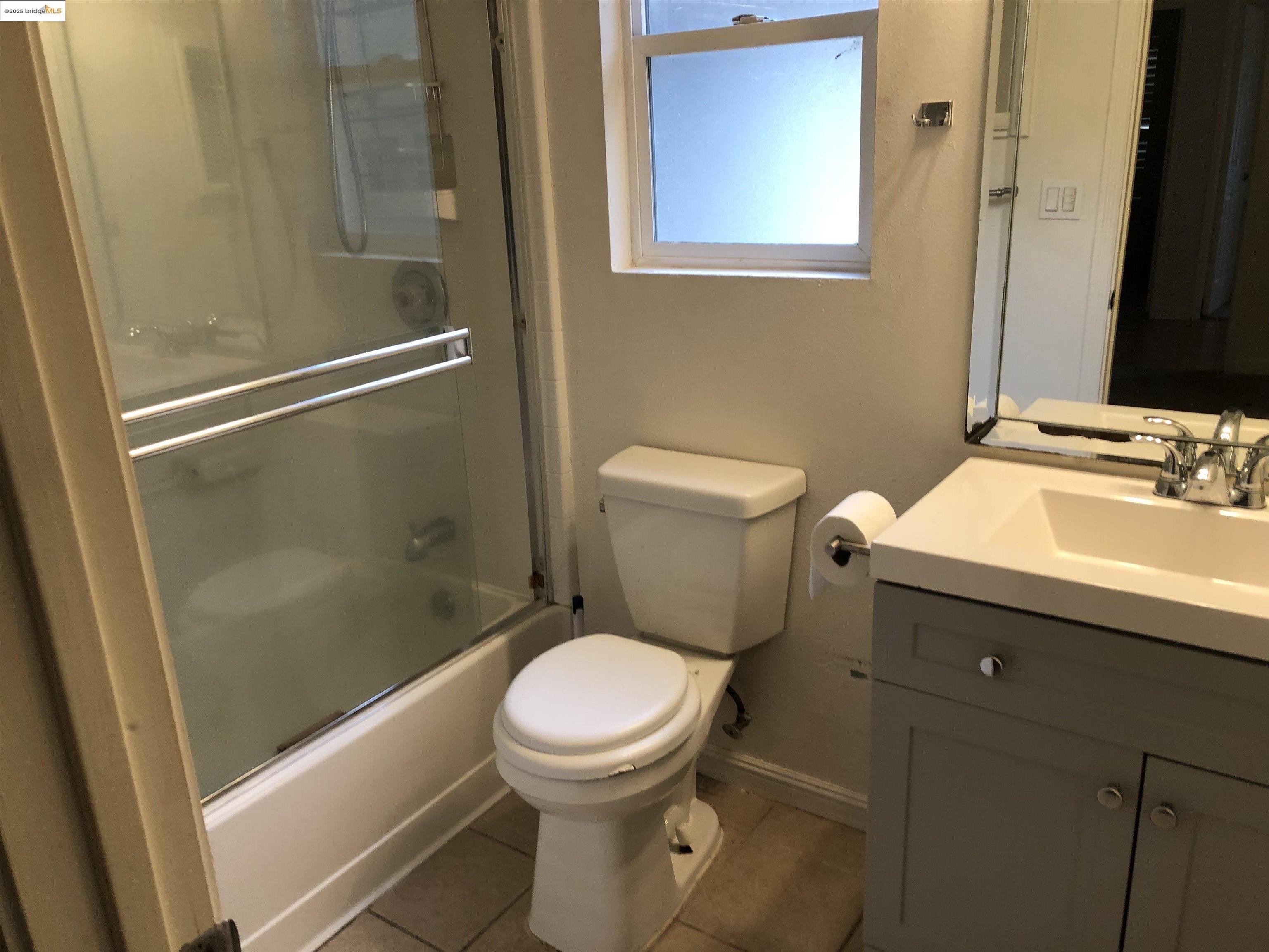 2174 Sugartree Drive Pittsburg, CA 94565 - Photo 10 of 12 Bathroom with vanity, enclosed tub / shower combo, and tile patterned flooring