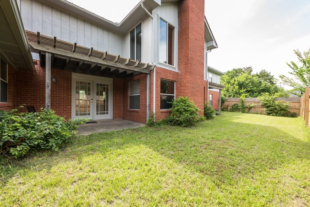 9554 David Fort Road Argyle, TX 76226 - Photo 33 of 35 a view of a house with brick walls plants and large tree