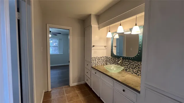 a bathroom with a shower a toilet and a sink