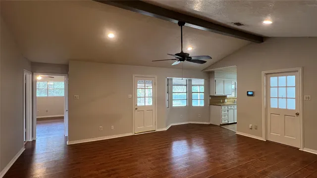a large kitchen with stainless steel appliances granite countertop a stove and a sink