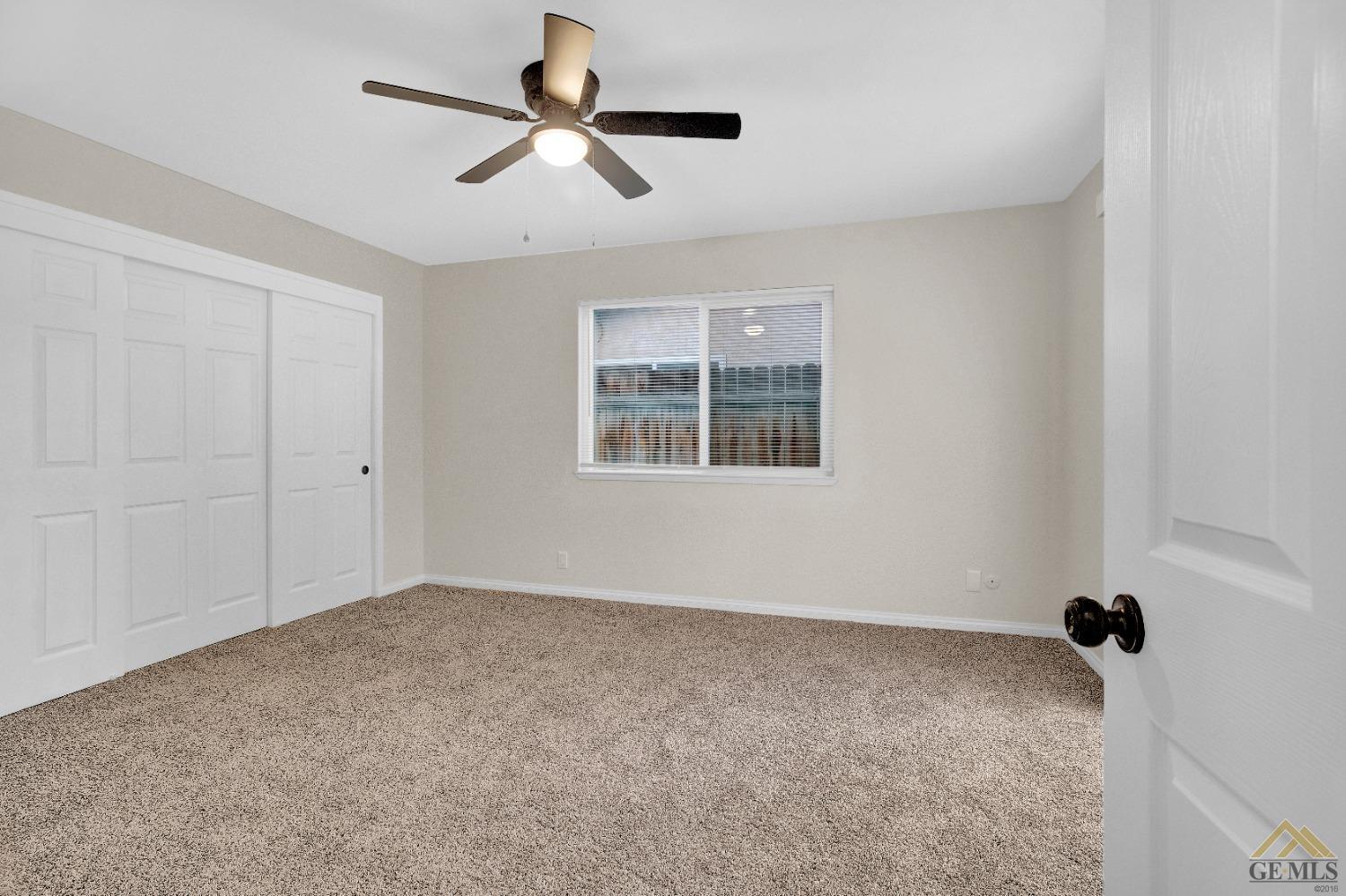 Undisclosed Address Bakersfield, CA 93304 - Photo 16 of 32 a view of an empty room with a window