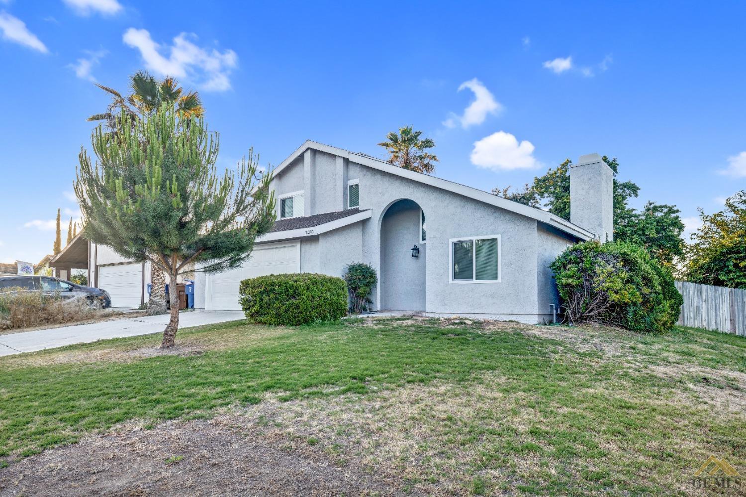 Undisclosed Address Bakersfield, CA 93304 - Photo 2 of 32 a view of a house with a yard