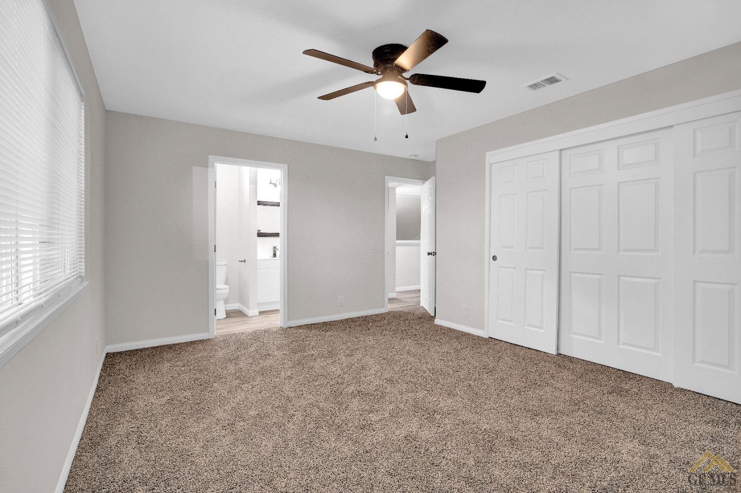 Undisclosed Address Bakersfield, CA 93304 - Photo 24 of 32 an empty room with ceiling fan and window