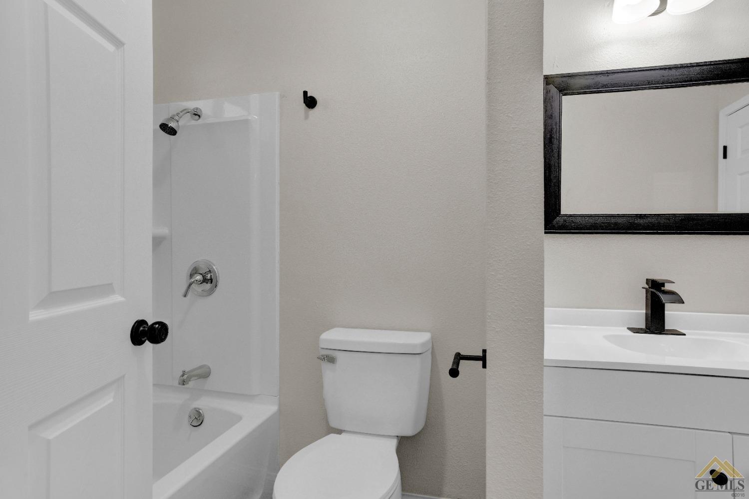 Undisclosed Address Bakersfield, CA 93304 - Photo 26 of 32 a bathroom with a sink toilet and shower