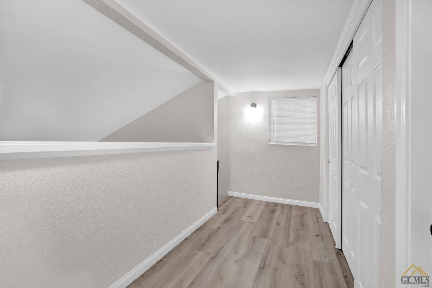Undisclosed Address Bakersfield, CA 93304 - Photo 28 of 32 a view of hallway with wooden floor