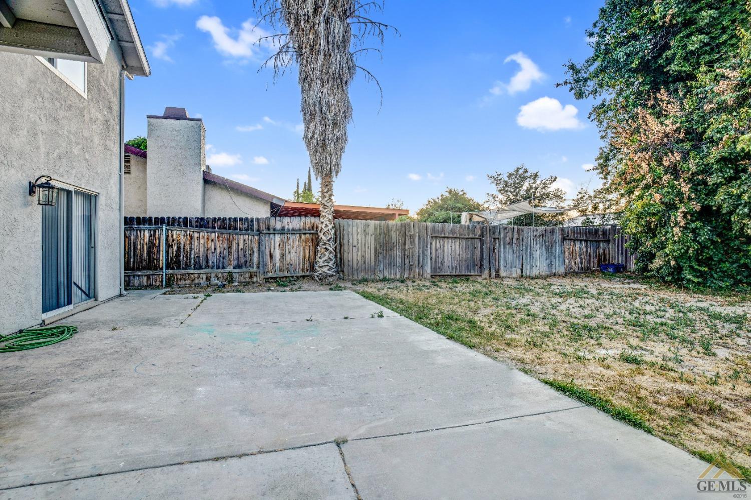 Undisclosed Address Bakersfield, CA 93304 - Photo 30 of 32 a view of a house with a yard