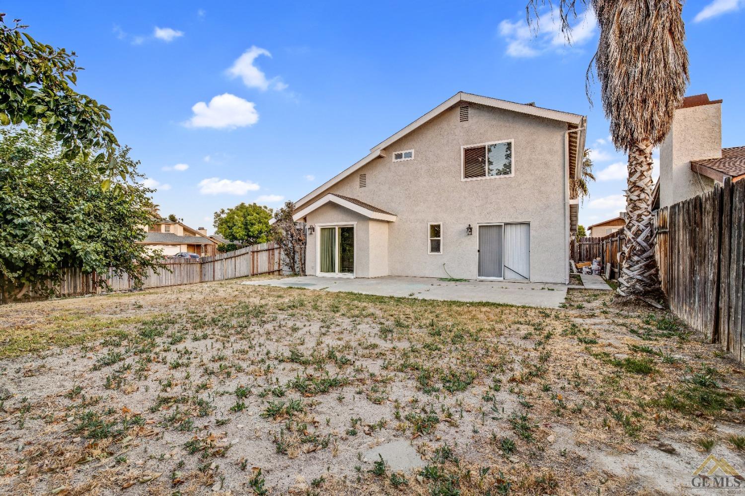 Undisclosed Address Bakersfield, CA 93304 - Photo 32 of 32 a view of a house with a yard