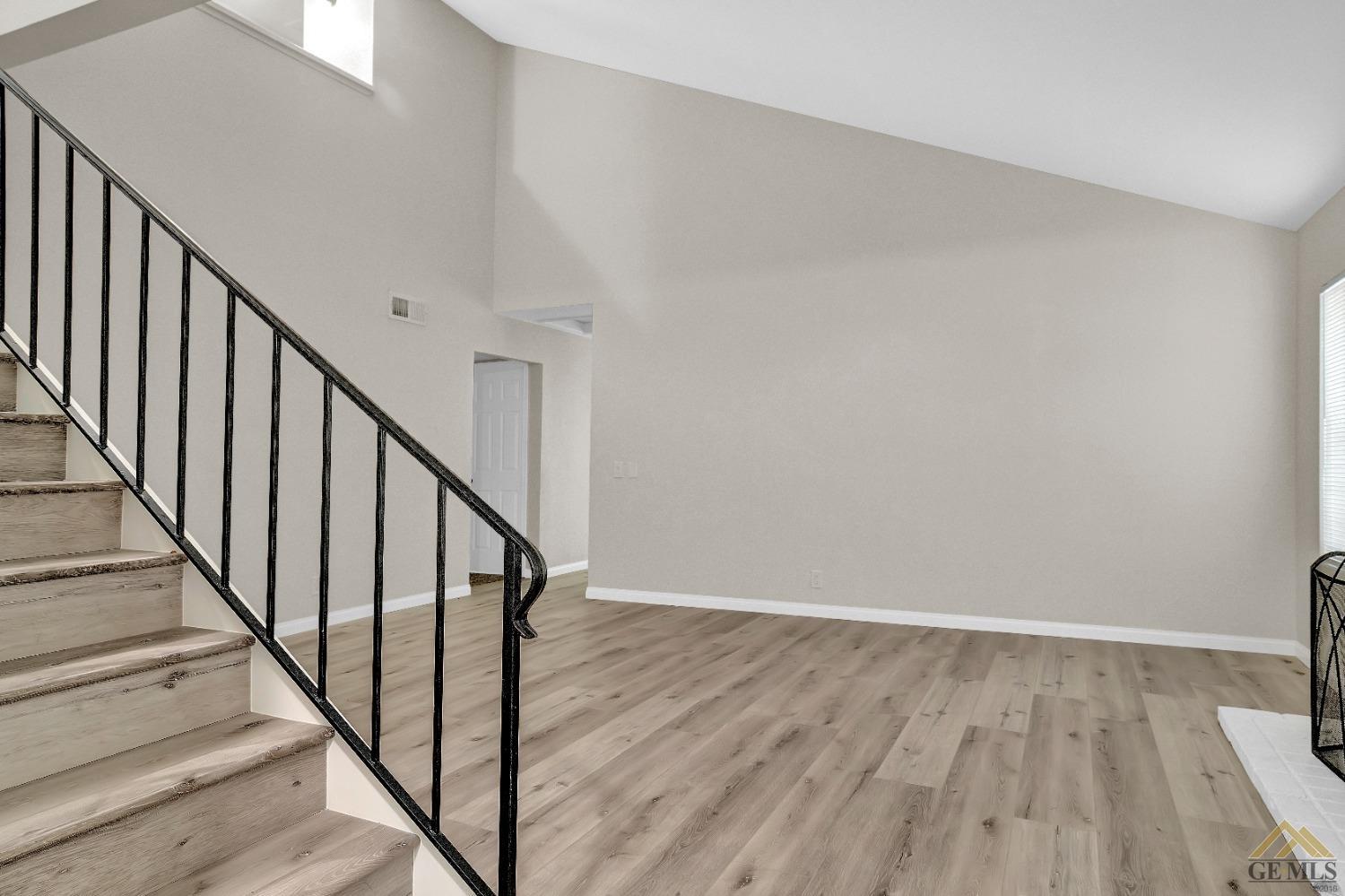 Undisclosed Address Bakersfield, CA 93304 - Photo 4 of 32 a view of staircase with wooden floor and white walls