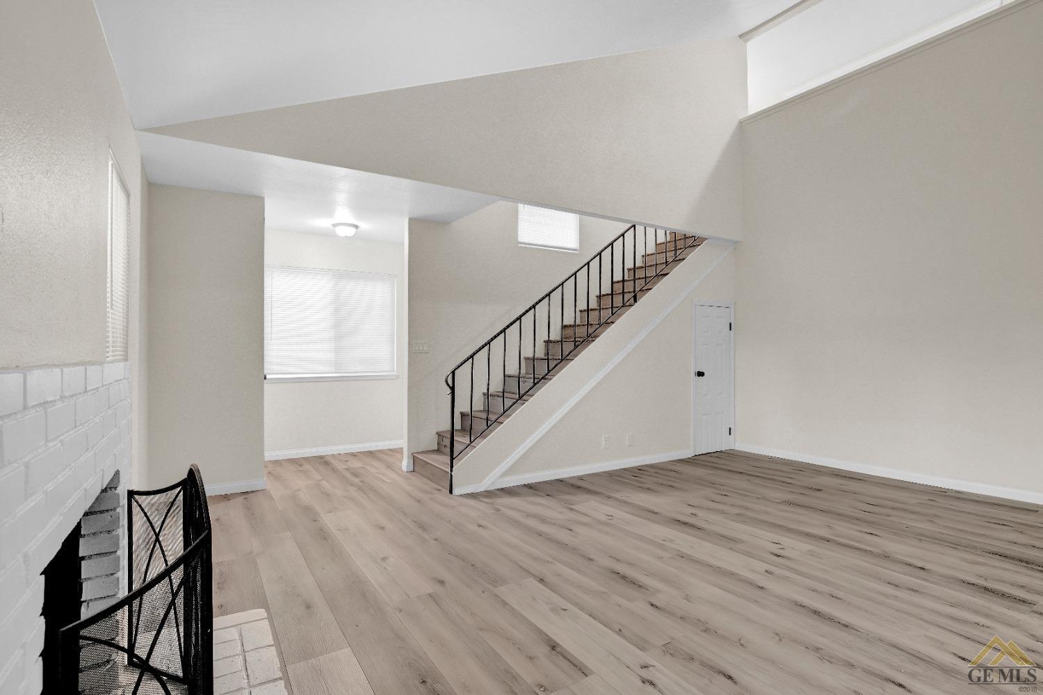 Undisclosed Address Bakersfield, CA 93304 - Photo 6 of 32 a view of an entryway with wooden floor