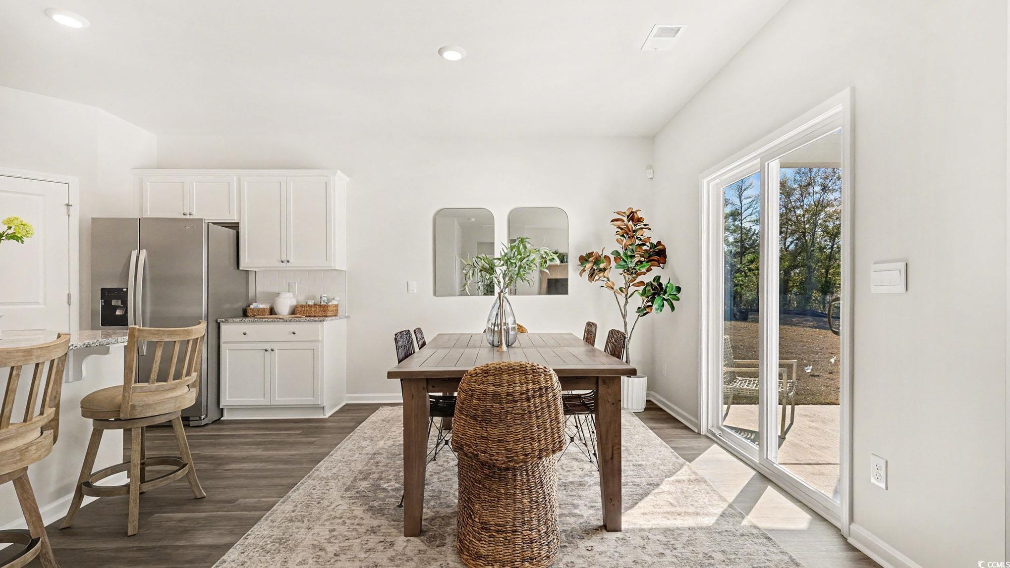 312 RookRoost Circle Conway, SC 29526 - Photo 11 of 29 Dining space with dark wood finished floors and recessed lighting
