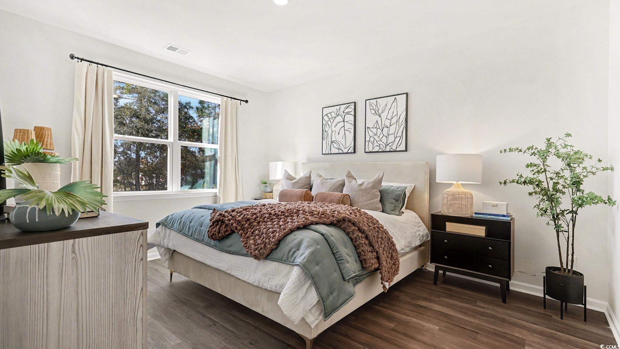 312 RookRoost Circle Conway, SC 29526 - Photo 16 of 29 Bedroom featuring dark wood-style flooring and baseboards