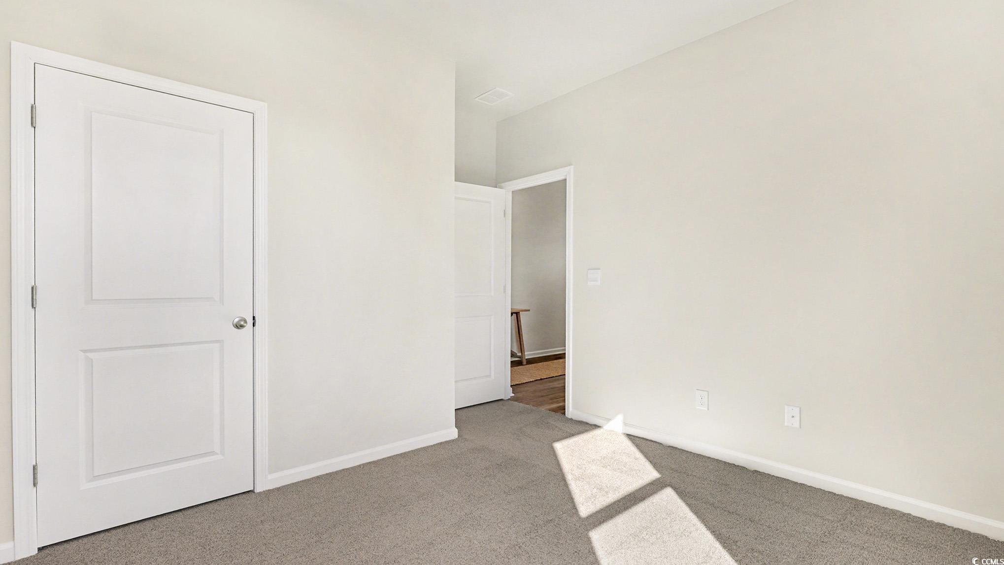 312 RookRoost Circle Conway, SC 29526 - Photo 23 of 29 Unfurnished bedroom with light colored carpet and baseboards
