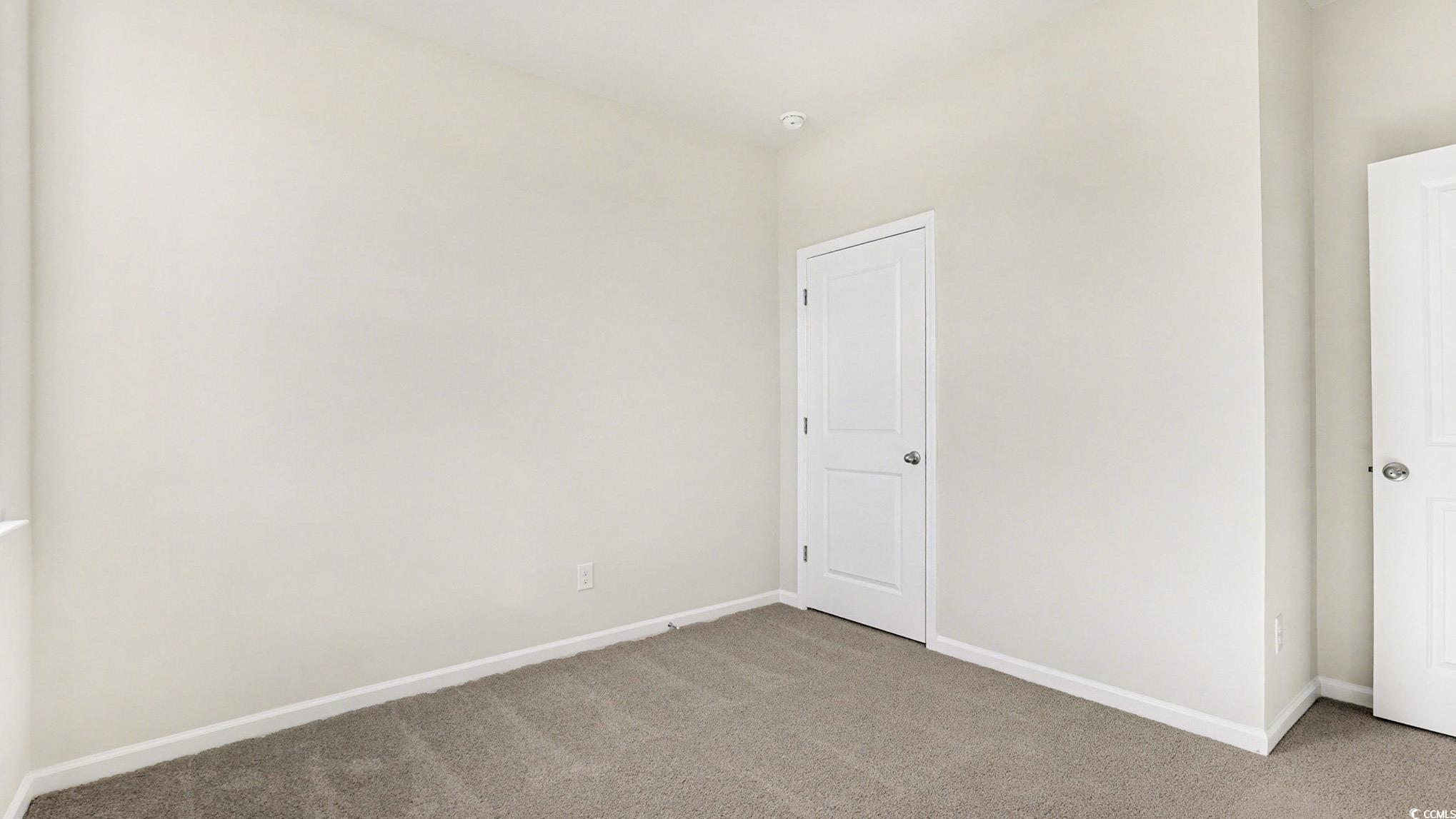 312 RookRoost Circle Conway, SC 29526 - Photo 24 of 29 Carpeted spare room featuring baseboards