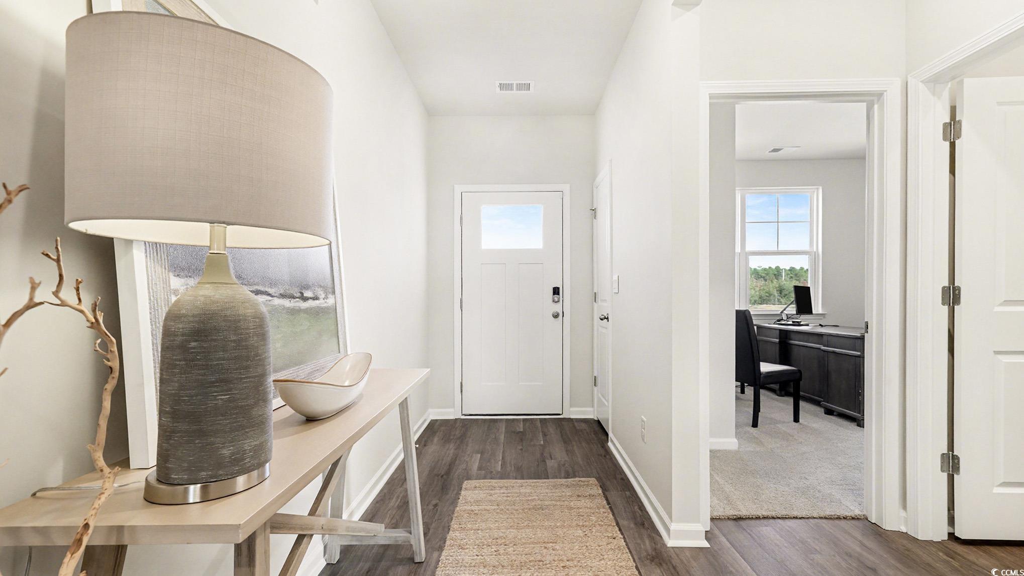 312 RookRoost Circle Conway, SC 29526 - Photo 4 of 29 Foyer with dark wood-type flooring and baseboards