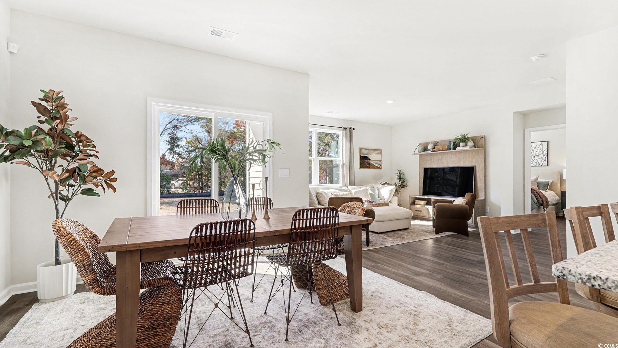 312 RookRoost Circle Conway, SC 29526 - Photo 10 of 29 Dining space featuring dark wood-type flooring