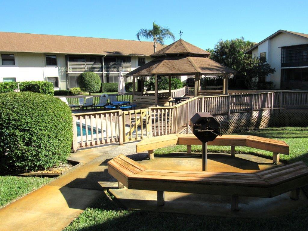 1841 Southwest Palm City Road, Unit 401D Stuart, FL 34994 - Photo 17 of 19 pool & barbeque