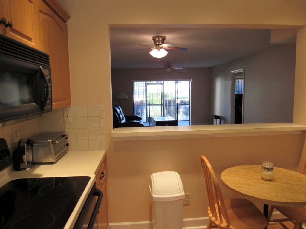 1841 Southwest Palm City Road, Unit 401D Stuart, FL 34994 - Photo 6 of 19 Kitchen passthru