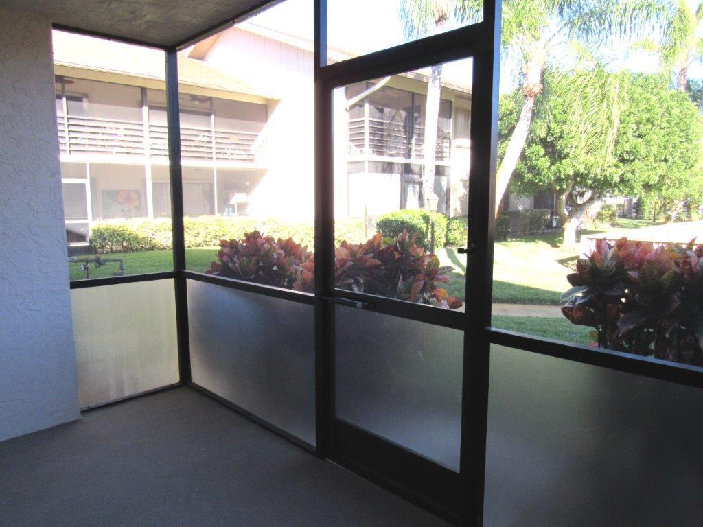 1841 Southwest Palm City Road, Unit 401D Stuart, FL 34994 - Photo 9 of 19 screened porch