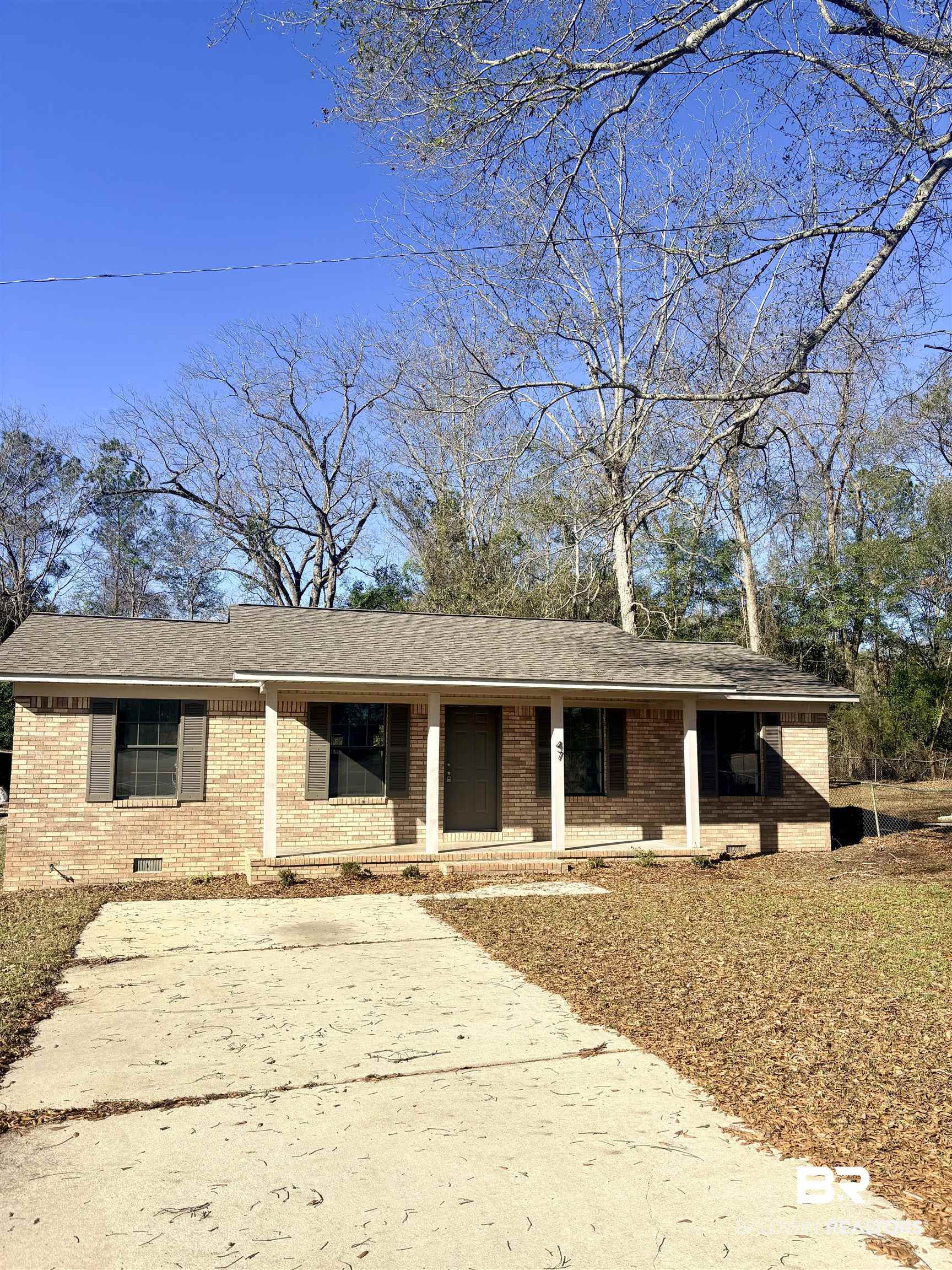47 Fairview Street Evergreen, AL 36401 - Photo 1 of 15 Ranch-style house featuring covered porch, brick siding, crawl space, and roof with shingles