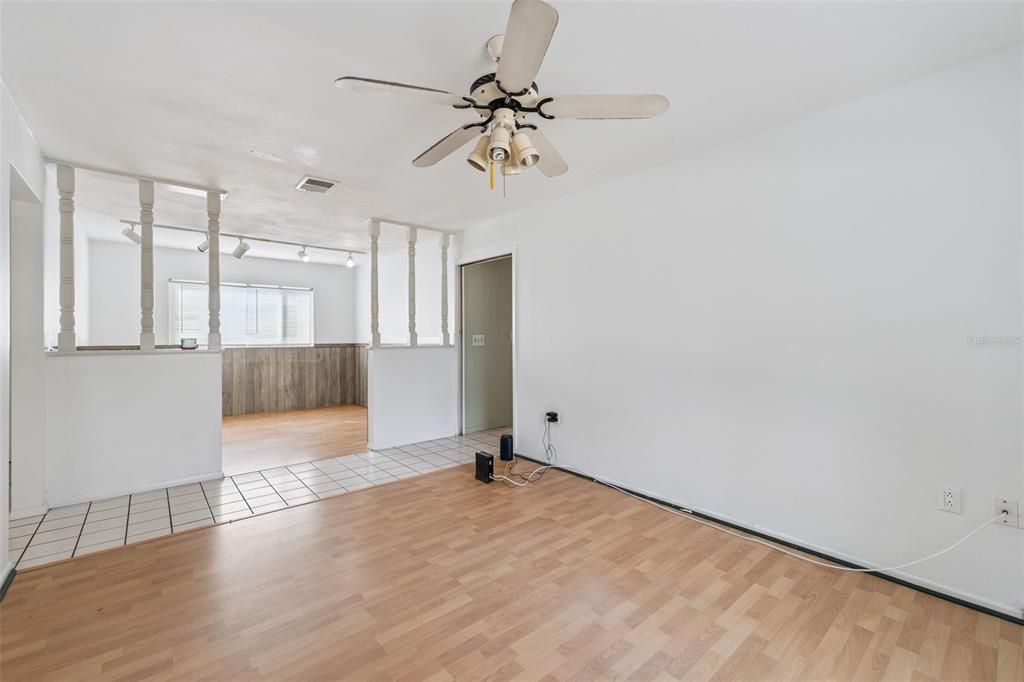 116 Hampden Road Winter Haven, FL 33884 - Photo 8 of 19 wooden floor in an empty room with a window