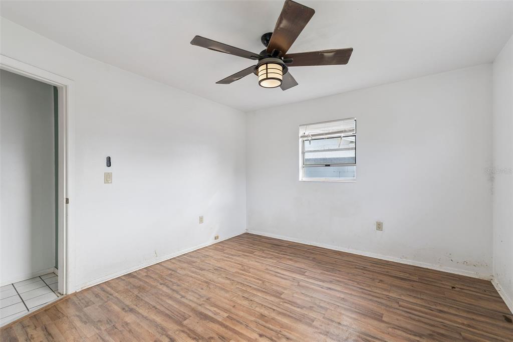 116 Hampden Road Winter Haven, FL 33884 - Photo 10 of 19 a view of a big room with wooden floor and windows