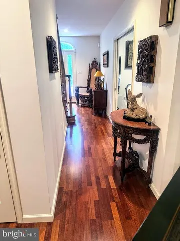 a dining room with furniture window and wooden floor