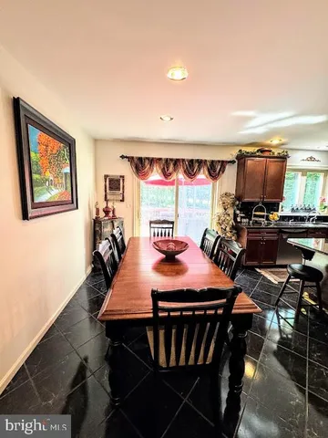 a bedroom with a bed and a television