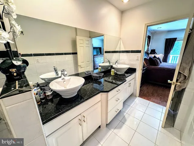 a bathroom with a shower and a sink