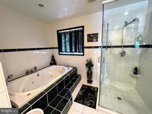 a bathroom with a sink vanity and mirror