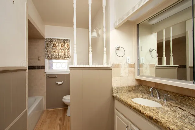 a bathroom with a shower and a sink